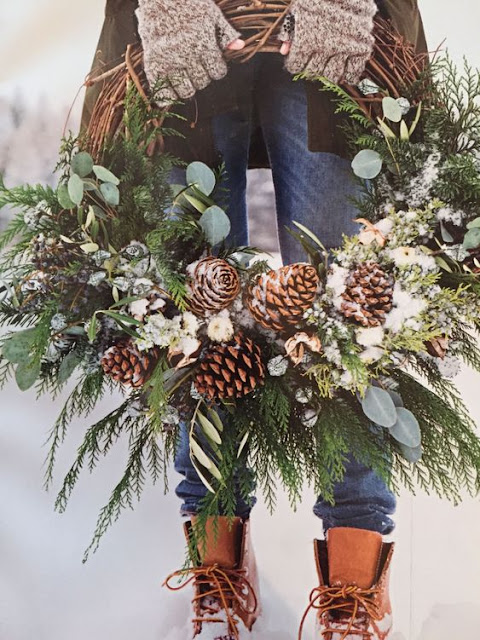 festive winter decor grapevine wreath with evergreens and pinecones